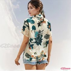 Whimsical Floral Shirt for Women with Adjustable Fastening and Button-Down Front Green Camp Collar Blouse For Summer, Summer Tops With Camp Collar And Buttons, Green Short Sleeve Shirt With Buttons For Summer, Summer Blouse With Buttons And Camp Collar, Casual Printed Blouse With Camp Collar, Hawaiian Style Tops With Button Closure For Spring, Hawaiian Summer Shirt With Buttons, Tropical Summer Tops With Button Closure, Summer Tropical Tops With Button Closure