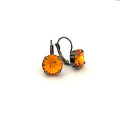 Halloween themed Pumpkin Orange 12mm Crystal Earrings / Hematite Gunmetal Setting Made with high quality crystals and Nickel free settings. Purple Earrings, Antique Earrings, Crystal Drop, Pumpkin Orange, Blue Earrings, Jewel Tones, Halloween Themes, Crystal Earrings, Jewelry Earrings Dangle