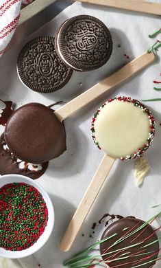 an assortment of cookies and ice creams on a table with sprinkles