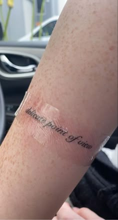 a person with a tattoo on their arm