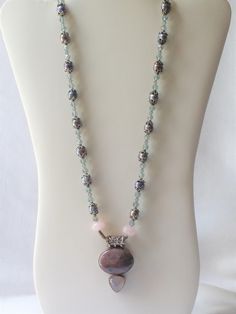 This is an estate necklace designed by estate owner.  The pendant was purchased at a gem show then the beads were strung to match the way she wanted .  The beads are sterling silver, cultured dyed pearls, blue swarvoski chrystal, and pink quartz. Elegant Single Strand Round Beads, Silver Czech Glass Necklace With Round Beads, Silver Polished Round Beads, Gems, And Cabochons, Pearl And Crystal Necklace With Silver Gemstone Beads, Silver Necklace With Czech Glass Round Beads, Sterling Silver Beaded Necklaces With Round Pendant, Silver Beaded Gemstone Pendant Necklace, Silver Pearl Crystal Necklace With Gemstone Beads, Elegant Beaded Crystal Necklace With Round Pendant