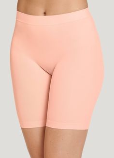 The Jockey® Skimmies Slipshorts help you conquer the day with comfortable coverage. This long-length, seamfree underwear style provides smoothing coverage and helps prevent panty lines. Silky-soft microfiber fabric creates a lightweight, sleek design without constriction. | Jockey® Skimmies Slipshorts in Peach Pearl Seamless 4-way Stretch Mid-thigh Shorts, Seamless Mid-thigh Length Shapewear For Loungewear, Solid Seamless 4-way Stretch Biker Shorts, Summer Solid Mid-thigh Length Shapewear, Solid Color Mid-thigh Length Shapewear For Summer, Summer Loungewear Shapewear In Short Length, Slip Shorts, Long Length, New Day