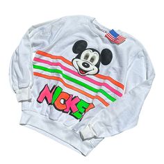 Vintage Disney Of Mickey Mouse Nwt Color: White & Neons Colors Size: M/L (Medium/Large) Vintage 1980s/1990s New With Tag Mickey Mouse Face Graphic W/ Holographic Eyes That Shift. Neon Stripes Xposted Ig @Dreamsofvintage_ D120 Disney Letter Print Sweatshirt For Streetwear, Cotton Sweatshirt With Cartoon Print For Disney Fan Events, White Sporty Sweatshirt With Cartoon Print, White Cotton Sweatshirt With Character Print, Disney White Top With Letter Print, Retro White Top For Disney Fan Events, Sporty Multicolor Character Print Tops, Sporty Multicolor Tops With Character Print, White Mickey Mouse T-shirt For Streetwear