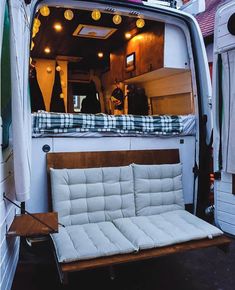 the back end of a van with a couch in it