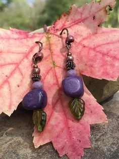 "Grape Hyacinth Bracelet~ handmade Glass leaves Copper Purple marble stone The last photo shows earrings with a matching bracelet, which can be viewed and/or purchased here: https://www.etsy.com/listing/252065992/grape-hyacinth-bracelet-2-strand-beaded?ref=shop_home_active_10 They measure just over 1\" long.  Clip-On options... please also let us know if you would prefer clip-ons for any of our earrings. As we make them all by hand in our studio, we should be able to accommodate. International buyers welcome- please contact us for a price to ship anywhere else. We will also be happy to combine shipping for items that may be safely packaged together. Postal insurance is available at an additional cost- please contact me for the price before payment.  We have four enchanting furry family mem Grape Hyacinth, Earrings Dangling, Purple Marble, Matching Bracelet, Marble Stone, Marble Stones, Bracelet Handmade, Matching Bracelets, Purple Green