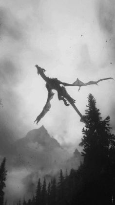 a dragon flying through the air with trees in the foreground and mountains in the background