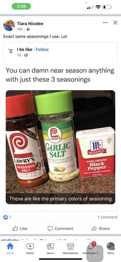 two jars of seasoning sitting on top of a counter