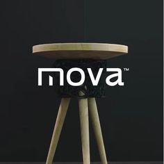 a wooden stool with the word mova on it