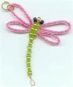 a pink and green beaded dragon keychain on a white background with black beads