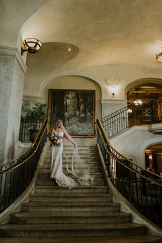 the bride is walking down the stairs to her wedding ceremony at the grand america hotel