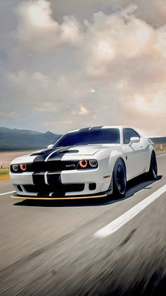 a white and black car driving down the road