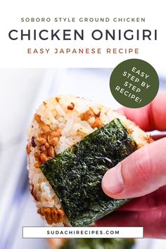 someone is holding up a piece of sushi with rice and spinach on it