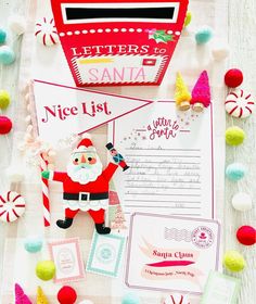 a santa letter to santa on top of a table with candy canes and candies