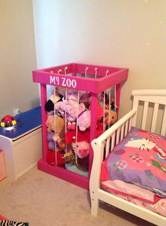 a small child's room with a toy crib and toys on the floor