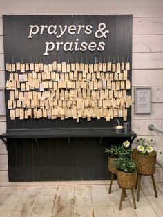 a sign that says prayers and praises with small notes attached to them on clothes pins