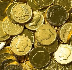 a pile of gold coins sitting on top of each other