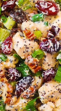 a salad with chicken, lettuce and cranberries