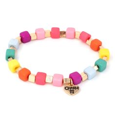 Knock, knock. HUE’s there? Lots of rainbow color and cubes to make the perfect charm bracelet stack! Add charms between the beads of this bracelet and customize her collection! features & materials Base Metal Acrylic 6" length WARNING: Choking Hazard - Small parts. Not for children under 3 years. Bracelet only, charms sold separately Charm Bracelet Stack, Custom Charm Bracelet, Charm It, Gold Book, Rainbow Necklace, Gold Charm Bracelet, Custom Charms, Rainbow Beads, Locket Charms