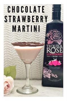 chocolate strawberry martini in a goblet next to an empty bottle