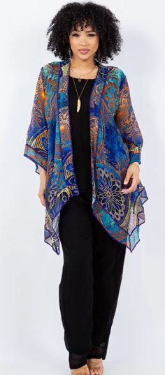 Poly blend SunHeart: Hi-Low Scarf Jacket adds pizzazz to all outfits. As you can see on our model, it's got extended front scarf hem with a higher back. A beautiful bright happy landscape. This has got a high "WOW!" factor. Become the diva you are. ONE SIZE FITS SML-1X+ • Bust 46" open• Upper Arm 20"• Hips 58" open • Length back 25" - front scarf hem 43" Fitted Bohemian Printed Outerwear, Bohemian Printed Outerwear, Blue Long Sleeve Outerwear One Size, Bohemian Outerwear For Layering, One-size Long Sleeve Outerwear For Festivals, Bohemian Outerwear With Relaxed Fit For Layering, Bohemian Outerwear For Layering With Relaxed Fit, Bohemian Relaxed Fit Outerwear For Layering, Oversized Blue Outerwear For Festival