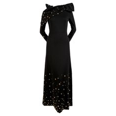 Exceptional, jet-black, wool jersey, maxi dress with gold toned studs and matching scarf designed by Givenchy dating to the 1970's. Dress fits a US 2 or 4. Measures approximately: 15" at shoulders, 32" at bust, 26" at waist, 36" at hips, 21.5" in arm length and 57" in overall length. Fully lined. Zips up center back. Made in France. Very good condition. Black Wool Dress, Givenchy Fashion, Jersey Maxi Dress, Witchy Woman, Scarf Design, Wool Dress, Gold Studs, Black Wool, Givenchy