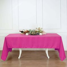 the table is covered with pink cloths