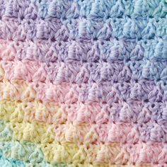 the crocheted blanket is multicolored and has two rows of different colors