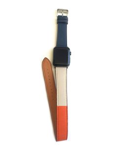 Men's and Women's NAVY, ORANGE, AND CREAM genuine leather strap. Leather strap contains white stitching around entire outer edge. Strap is designed to wrap around the wrist twice creating a solid cuff look. This Apple Watch Band fits all apple series watches sized 42/44mm. Fits wrist sizes 6.5-8 Modern Multicolor Apple Watch Band, Modern Multicolor Rectangular Apple Watch Band, Rectangular Watch With Black Band, Rectangular Watch With Adjustable Black Band, Adjustable Rectangular Watch With Black Band, Adjustable Bracelet Strap Apple Watch Band For Business, Multicolor Adjustable Watch Bands For Everyday Use, Apple Watch Bands Mens, Mens Navy