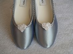 Beautiful and simple comfortable flats! Dyed to silver and hand trimmed with a beautiful braided metallic sequins trim, and a PAIR OF HEARTS crystal brooch on the front enhances this classic style! If, in doubt of silver tone, you may purchase a color sample for $3.00 USD www.etsy.com/listing/129787069/buy-color-swatch-samples-or-buy-lace For the Bride, Bridesmaids, MOBs, Wedding Anniversaries, or anyone needing comfortable flats. Outer sole is leather swede. Not for Wet areas/grass. Sizes: US S Elegant Silver Almond Toe Flats, Elegant Silver Closed Toe Flats, Silver Closed Toe Flats For Wedding, Silver Round Toe Flats For Wedding, Silver Closed Toe Flats, Satin Ballet Slippers, Silver Flat Shoes, Wedding Flats, Ballet Slippers