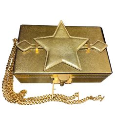 Oscar De La Renta Alibi Lam Leather Star Handle Box Clutch Worn By Beyonce On September 12, 2021 In Portofino ***Can Be Worn As A Clutch Or Shoulder Handbag On A Chain** Structured Minaudire With Utilitarian Hardware Removable Shoulder Chain Top Handle Top Flap With Clasp Closure Goldtone Hardware 1 Interior Compartment Interior Card Slot Leather Trim: Brass Made In Italy Size Height: 4.75" Width: 7.75" Depth: 2.25 This Is A Sample *****One Of One***** This One Has The Star On The Handle (Pictur Rectangular Clutch With Original Box As Gift, Top Handle Clutch With Original Box As Gift, High-end Gold Crossbody Box Bag, Top Handle Clutch As Gift, High-end Gold Rectangular Shoulder Bag, High-end Gold Shoulder Bag As Gift, High-end Gold Bag As Gift, Designer Gold Rectangular Case Bag, High-end Box Bag With Gold-tone Hardware As Gift