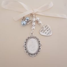 a key chain with two charms attached to it