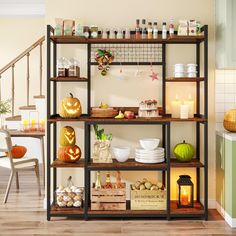 a shelf filled with lots of different types of food and candles on top of it