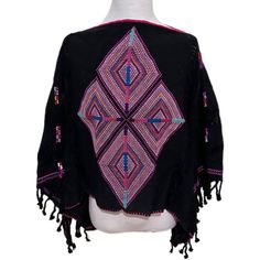 Hand Embroidered And Woven Nwot Huipil Poncho Top From Mexico In Black And Multicolor Embroidery With Tassels And Distressing In The Fabric. Purchased In Mexico And Never Worn. Flat Lay Measure Of The Waist Is Approximately Lay Measurements Are In Photos. Please Look At All Photos And Ask If You Have Any Questions. Traditional Black Cape For Festival, Black Shawl Poncho For The Beach, Bohemian Black Cape For Festival, Traditional Black Festival Cape, One Size Black Cape For Festival, Black Folk Style Shawl For Festival, Embroidered Long Sleeve Poncho For Festival, Black Shawl Poncho For Festival, Black Shawl Poncho For Beach