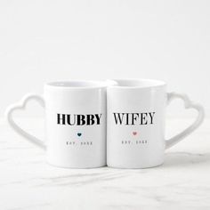 two white coffee mugs with the words hubby wiffley and heart shaped handles