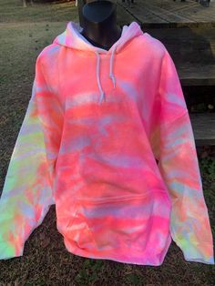 I accidentally made this hoodie and now I'm quite happy that I did!  The orange and pink goes together so well in this tie dye hoodie. Now I'm going to have to make me one! LOL I'm happy to offer this to customers and I hope you guys like this neon style hoodie as much I do.  Each hoodie is 50% cotton and 50% polyester. They are soft and comfy. I use mens hoodies because there is a little more room to move and are more comfortable.  I normally use Gildan or Hanes brand. So please order your size accordingly.  WASHING INSTRUCTIONS: turn your tie dye hoodie inside out before washing in cold water. Dry as you normally would or hang to dry.  Thank you for stopping by my shop. Feel free to message me with any questions you may have. Trendy Tie Dye Long Sleeve Hoodie, Trendy Tie Dye Hooded Sweatshirt, Trendy Tie Dye Sweatshirt For Streetwear, Trendy Tie-dye Hoodie For Winter, Trendy Tie Dye Hoodie For Winter, Trendy Tie Dye Winter Hoodie, Oversized Tie-dye Hoodie For Streetwear, Oversized Tie Dye Hoodie For Streetwear, Trendy Cotton Tie Dye Sweatshirt