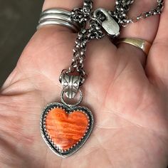 Orange Spiny Oyster Heart Pendant with Thick Rolo Chain – Sangria Silver Designs Unique Orange Sterling Silver Necklace, Sterling Silver Orange Cabochon Jewelry, Orange Cabochon Sterling Silver Jewelry, Orange Sterling Silver Round Pendant Jewelry, Unique Orange Round Pendant Jewelry, Orange Heart Charm Jewelry, Unique Orange Sterling Silver Jewelry, Collectible Orange Sterling Silver Jewelry, Handmade Heart-shaped Orange Jewelry