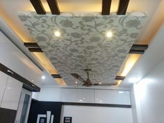 the ceiling is decorated with white and black designs