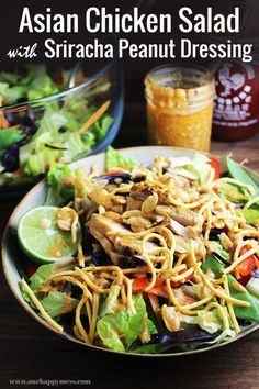 a salad with chicken and noodles on a plate