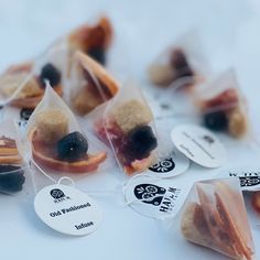 small bags filled with assorted pastries on top of a table