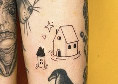 two tattoos on the legs of people with different things in them and one has a house