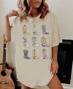 Ya'll Cowgirl Bachelorette's ready to party? Let's Go Girls with our Western Oversize graphic tee for that boot scootin' cowgirl vibe in you!  Lime Cordial styles are cool AF....just ask our customers! Exclusively designed by authentic 90s B*tches obsessed with pop culture Made in the U.S  PLEASE READ THE DESCRIPTION BEFORE PURCHASING  ✿ To ensure the desired fit, please refer to our UNISEX SWEATER SIZE CHART in the pictures. ✿ Available shirt sizes: S - 3XL (sizes run like men's) ✿ Most women find that their typical size works best as a slightly oversized fit ✿ PLEASE BE AWARE We're recreating the aged look of an old-school, worn-out design that has been washed so many times the ink has been cracking and chipping off for years.  DETAILS  Ribbed knit collars to bolster shaping.  Dual side Bachelorette Party Western, Lets Go Girls Shirt, Clothing Quotes, Oversize Graphic Tee, Cowgirl Bachelorette Party, Cowgirl Bachelorette Parties, Lets Go Girls, Cowgirl Bachelorette, Southern Shirt