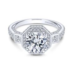 a white gold engagement ring with diamonds on the sides