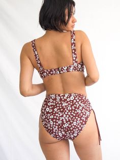 Inspired by vintage underpinnings, this ultra-feminine but not fussy top goes great at the beach or pared with your favorite 501s. Features broad shoulder straps and a peek-a-boo opening with adjustable tie front. The back features Galamaar's signature rubberized g-hook closure with 3-loop adjustment for an individualized fit. Made in Los Angeles of Italian fabric. 88% recycled Econyl® / 22% Spandex Underwire Swimwear With Tie Straps For Poolside, Beachwear Swimwear With Underwire And Tie Straps, Beachwear Swimwear With Tie Straps And Underwire, Underwire Swimwear With Tie Straps For Beach, Surf Bikinis, Surf Suit, Beach Sunglasses, Baby Swimming, Swimsuits High Waisted