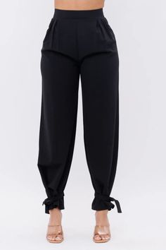 Experience the height style with these deluxe black pants. With a high waist fit, side pockets, and ankle ties, these pants provide a chic look. Perfect for styling an array of outfits, add a touch of sophistication with these beautiful pants. Black Side pockets High waist Ankle tie 33"Inseam Tie Pants, Chic Look, Of Outfits, High Waist Bottoms, Black Side, Pocket Pants, Ankle Pants, Pants Black, Black Pants