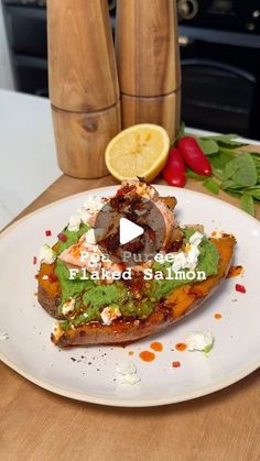 a white plate topped with food on top of a wooden table