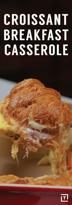 a close up of a sandwich on a plate with the words croissant breakfast casserole