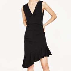 Zara Black Sleeveless Asymmetrical Hem With Frill Dress. V-Neck With Draped Detail On The Front Of The Hip And On The Back. - Condition Is New With Tags - Size: L In Black - V- Neck - Sleeveless - Asymmetric Frill At The Hem. - Visible Metallic Zip Fastening In The Back. - 98% Polyester, 2% Elastane Flirty Sleeveless V-neck Dress For Party, Sleeveless V-neck Dress With Ruffles For Date Night, Flirty Sleeveless Asymmetrical Dress For Party, Flirty Sleeveless Asymmetrical Party Dress, Flirty Sleeveless V-neck Party Dress, Fitted Sleeveless Asymmetrical Dress For Date Night, Chic Asymmetrical Dress With V-neck For Date Night, Chic Asymmetrical V-neck Dress For Date Night, Chic Asymmetrical V-neck Dress For Night Out