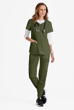 Subtle details make all the difference with Carly- our Grey’s Anatomy 3-Pocket Sport Women’s Scrub Top! Zoom in to see the V-neck has piping and a rib-knit accent. The front and back showcase rib-knit insets and princess seams. Shirttail hem rounds out the look. And you can t forget the antimicrobial fabric properties that will keep you fresh all shift long! Experience unrivaled flexibility! Our Grey s Anatomy Spandex Stretch collection adds a new layer of flexibility to your medical uniform war Nurses Uniform Modern, Scrub Fashion, Medical Clothes, Nursing Scrubs Pattern, Top Uniform, Scrubs Pattern, Book Outfits, Stylish Scrubs, Nursing Scrubs