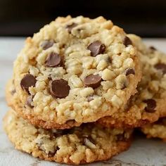 three chocolate chip cookies stacked on top of each other