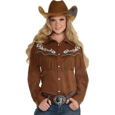 Saddle up for a wild west Halloween in this brown button up shirt. It features a blue and white printed chest design that sits just above a layer of fringe. Pair it with your biggest hat and best pair of boots (sold separately) to complete the look.Adult Brown Western Cowgirl Button Up Fringe Shirt product details:Attached chest fringeFront snap closuresLong sleevesLonger front hem100% polyester stretch fabric exclusive of decorationsAccessories and pants not includedOne size fits up to37in ches Barrel Racing Shirts, Halloween Western, First Halloween Costumes, Light Blue Trim, Brown Cowboy Hat, Cute Cowgirl Outfits, Western Dresses For Women, Cowgirl Style Outfits, Chest Design